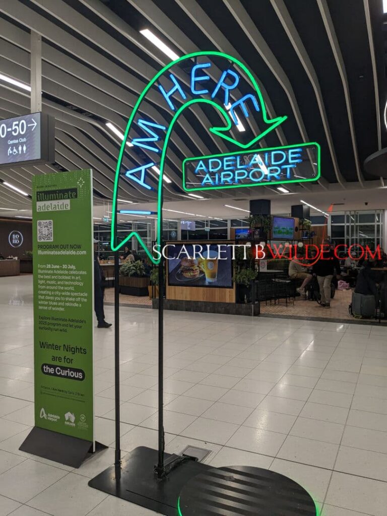 Neon Sign at Adelaide Airport saying ' I'm here "